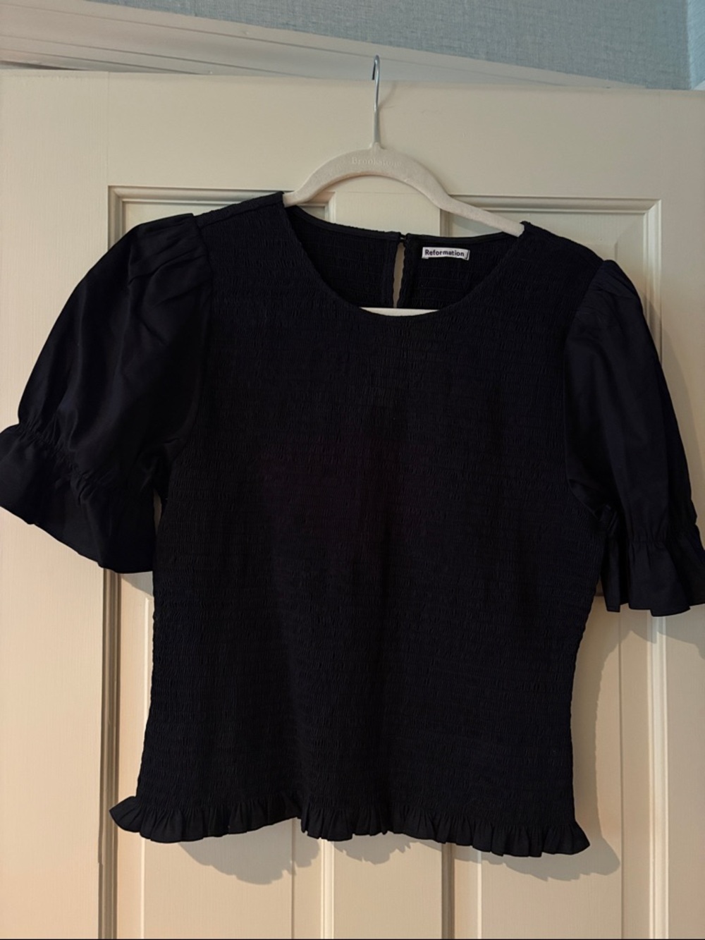 Reformation black smocked top
